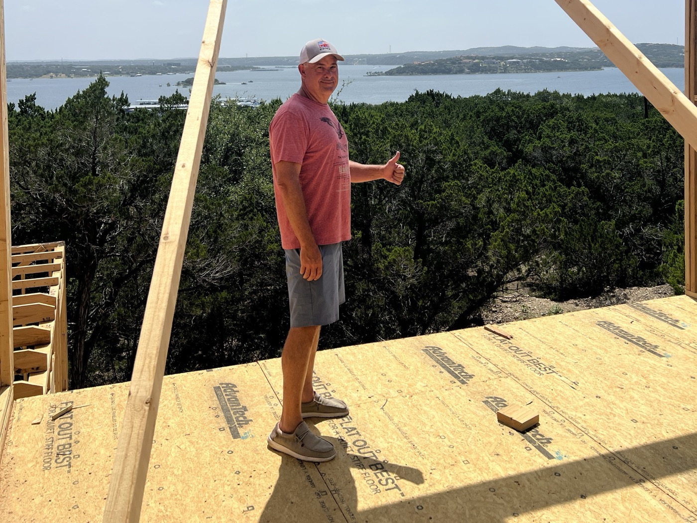 Joel Plouffe, President of Capital Hills Development, on site at a custom home build overlooking Lake Travis